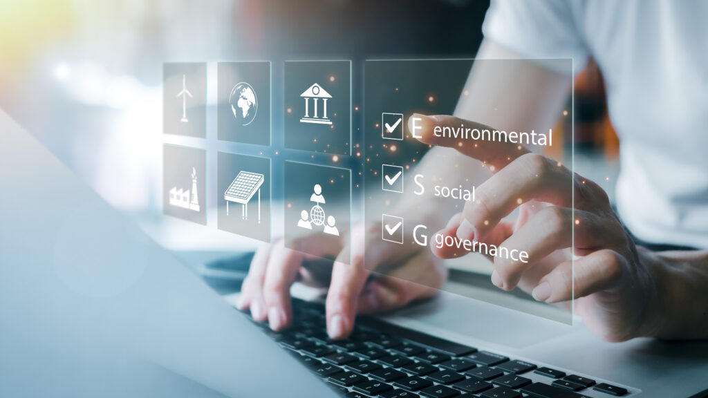 Person at a laptop interacting with an ESG environmental social governance digital interface